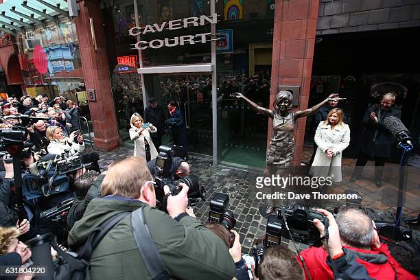Crowds gather to watch the unveiling of a statue in memory of Cilla Black at The Cavern Club on January 16, 2017 in Liverpool, United Kingdom.