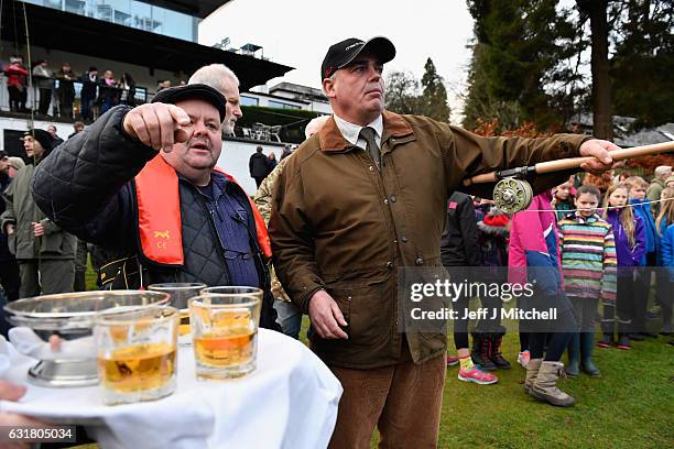 Scott Mackenzie, casts the first line as angelers gather at the River Tay for the opening of the Salmon Fishing season on January 16, 2017 in...