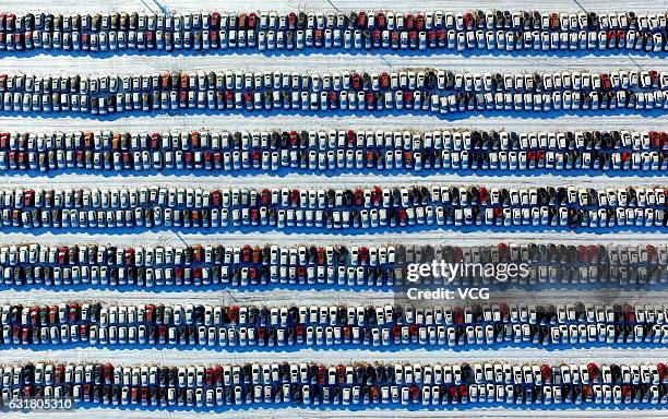 Aerial view of thousands of new cars lining up at a parking lot on January 16, 2017 in Shenyang, Liaoning Province of China.