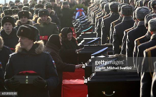Russian officers pay their last respects during a funeral ceremony for members of the Alexandrov Ensemble who died in a plane crash, on January 16,...
