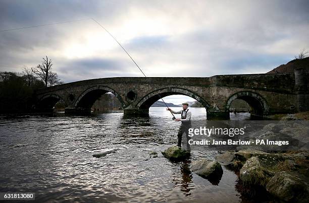 Angler Alan Wilson, from Glasgow, on the River Tay in Kenmore, near Perth, on the opening day of the salmon fishing season.
