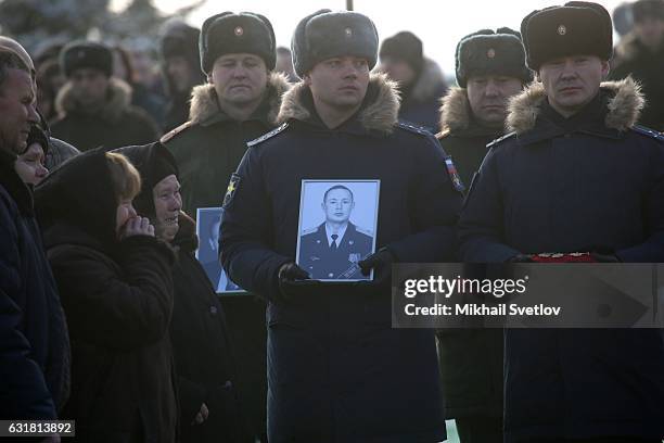 Russian officers, relatives and friends pay last respect during a funeral ceremony for the Alexandrov Ensemble members on January 16, 2016 in Moscow,...