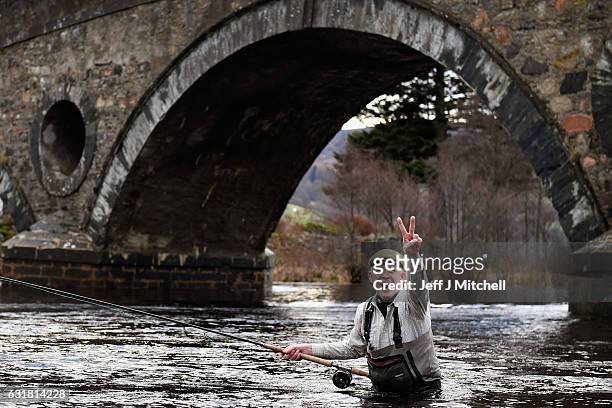 Alan Wilson, reacts as he joined fellow angelers gather at the River Tay for the opening of the Salmon Fishing season on January 16, 2017 in Kenmore,...
