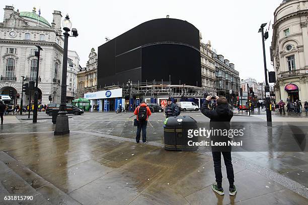 The iconic Piccadilly Circus advertising boards remain switched off as work begins on their replacement on January 16, 2017 in London, England. The...