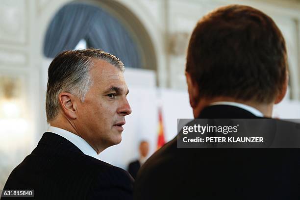 Sergio Ermotti , UBS CEO and Alexandre Zeller, chairman of Credit Suisse AG, talk during a business roundtable of Swiss business leaders with China's...