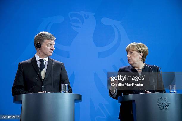 German Chancellor Angela Merkel and New Zealand's Prime Minister Bill English are pictured during a news conference at the Chancellery in Berlin,...