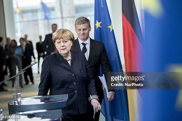 German Chancellor Angela Merkel and New Zealand's Prime Minister Bill English arrive to a news conference at the Chancellery in Berlin, Germany on...