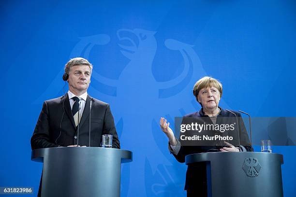 German Chancellor Angela Merkel and New Zealand's Prime Minister Bill English are pictured during a news conference at the Chancellery in Berlin,...