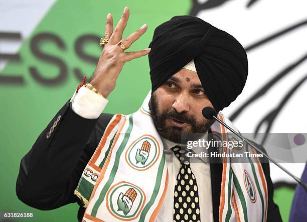 Navjot Singh Sidhu joins Congress party during a press conference at AICC HQ on January 16, 2017 in New Delhi, India. Cricketer-turned-politician and...