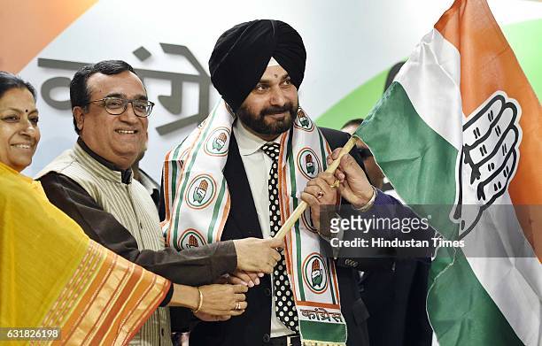 Navjot Singh Sidhu joins Congress party during a press conference at AICC HQ on January 16, 2017 in New Delhi, India. Cricketer-turned-politician and...