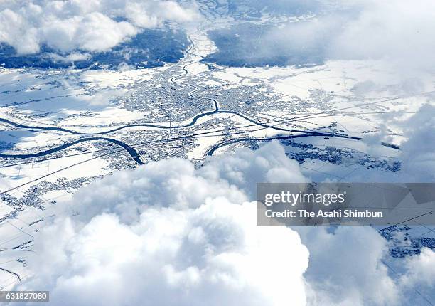 In this aerial image, Sanjo city is covered with snow as snow falls in wider area on January 15, 2017 in Sanjo, Niigata, Japan. The Meteorological...