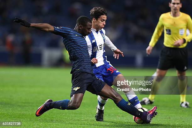 Porto's Spanish midfielder Oliver Torres vies with Moreirense's forward Ousmane Drame during the Premier League 2016/17 match between FC Porto and...