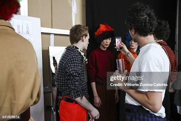 Francesco Risso and models are seen backstage ahead of the Marni show during Milan Men's Fashion Week Fall/Winter 2017/18 on January 14, 2017 in...