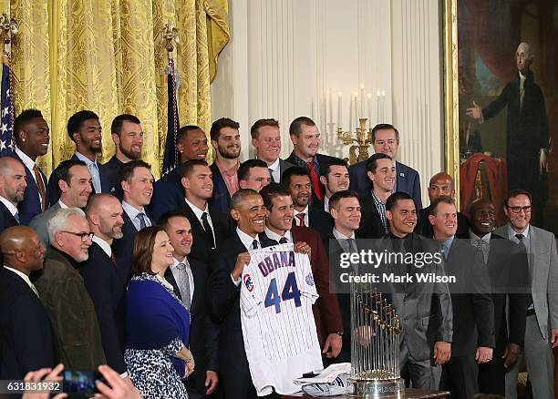 President Barack Obama poses for a picture with members of the 2016 World Series Champion Chicago Cubs in The East Room at the White House, on...