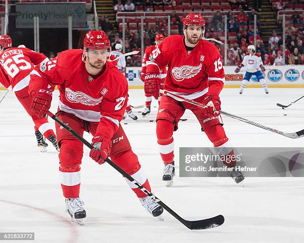 Tomas Tatar and Riley Sheahan of the Detroit Red Wings warm-up prior to an NHL game at Joe Louis Arena on January 16, 2017 in Detroit, Michigan.