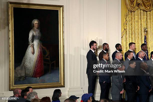 Members of the 2016 World Series Champion Chicago Cubs stand on a stage and listent to President Barack Obama honor them at the White House, on...
