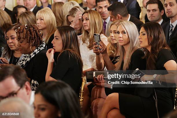 Major League Baseball World Serise champion Chicago Cubs players' wives and family members join a celebration for the team in the East Room of the...