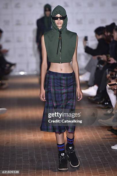 Model walks the runway at the Palm Angels Autumn Winter 2017 fashion show during Milan Menswear Fashion Week on January 16, 2017 in Milan, Italy.