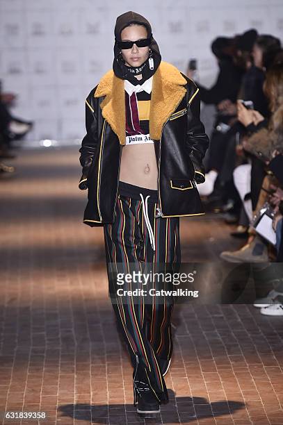 Model walks the runway at the Palm Angels Autumn Winter 2017 fashion show during Milan Menswear Fashion Week on January 16, 2017 in Milan, Italy.