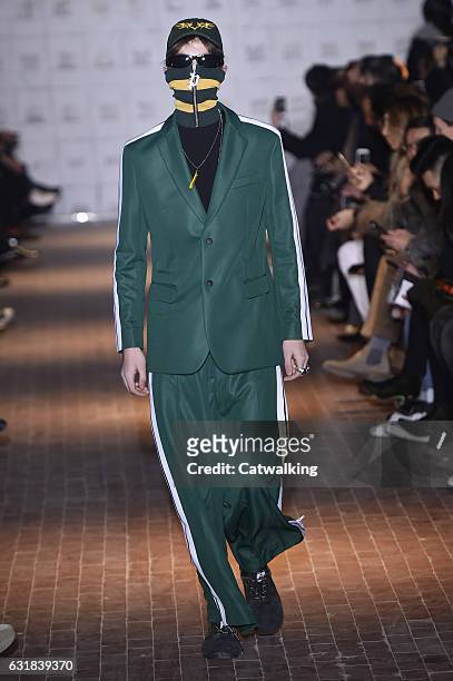 Model walks the runway at the Palm Angels Autumn Winter 2017 fashion show during Milan Menswear Fashion Week on January 16, 2017 in Milan, Italy.