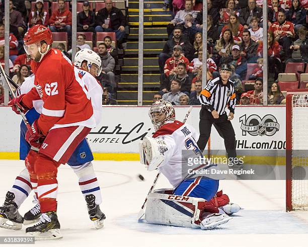 Thomas Vanek of the Detroit Red Wings scores a second period goal on Carey Price of the Montreal Canadiens during an NHL game at Joe Louis Arena on...