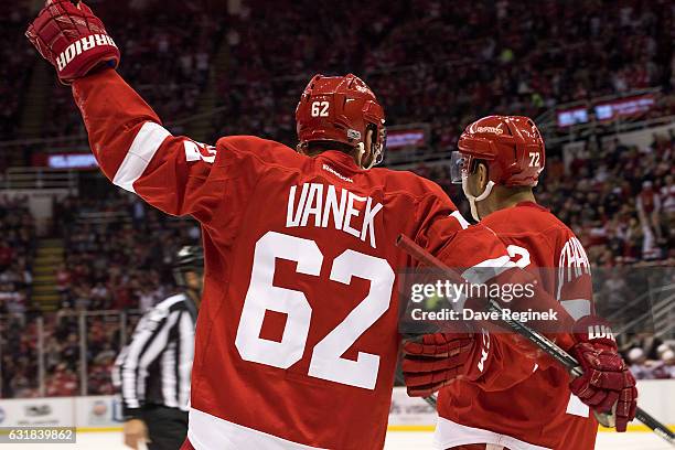 Thomas Vanek of the Detroit Red Wings celebrates a second period goal with teammate Andreas Athanasiou during an NHL game against the Montreal...