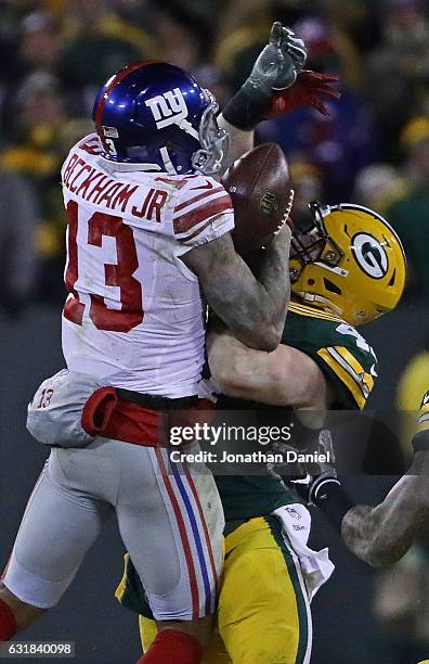Jake Ryan of the Green Bay Packers hits Odell Beckham Jr of the New York Giants at Lambeau Field on January 8, 2017 in Green Bay, Wisconsin.
