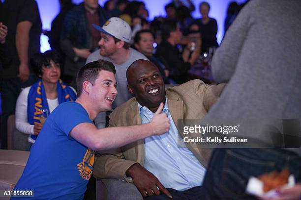 Golden State Warriors legend Adonal Foyle poses for photos with fans at the first American Express "All for Dub Nation" Watch Party at The Pearl on...