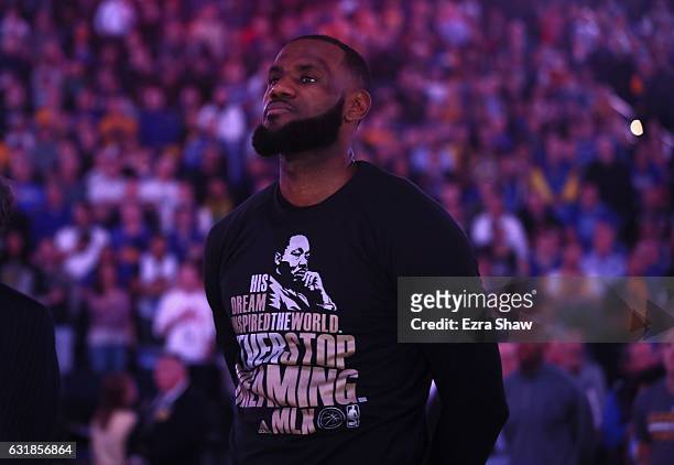 LeBron James of the Cleveland Cavaliers wears a shirt honoring Martin Luther King Jr. During the playing of the National Anthem before their game...