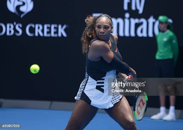 Serena Williams of the United States retunes the ball to Belinda Bencic of Switzerland on day two of the Australian Open 2017 at Melbourne Park in...