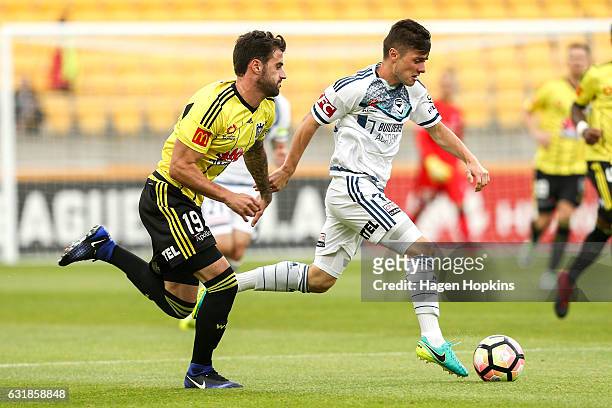 Marco Rojas of Melbourne Victory is challenged by Tom Doyle of the Phoenix during the round seven A-League match between the Wellington Phoenix and...