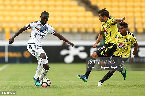 Vince Lia of the Phoenix tackles Jason Geria of Melbourne Victory during the round seven A-League match between the Wellington Phoenix and the...