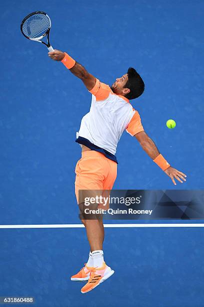 Fernando Verdasco of Spain plays a backhand in his first round match against Novak Djokovic of Serbia on day two of the 2017 Australian Open at...