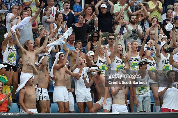 Fans celebrate after Jordan Thompson of Australia wins his first round match against Joao Sousa of Portugal on day two of the 2017 Australian Open at...