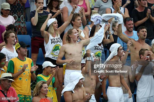 Fans celebrate after Jordan Thompson of Australia wins his first round match against Joao Sousa of Portugal on day two of the 2017 Australian Open at...