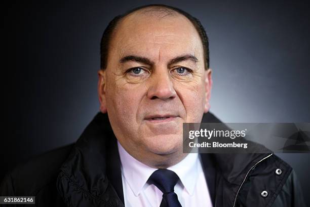 Axel Weber, chairman of UBS Group AG, poses for a photograph following a Bloomberg Television interview during the World Economic Forum in Davos,...