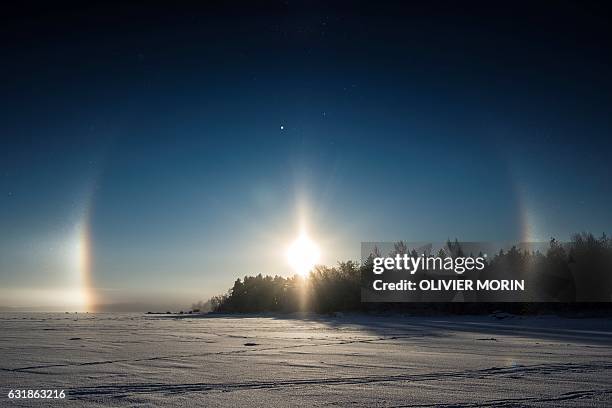 Solar halo is pictured over the frozen sea in Vaasa by -15°C, on January 15, 2017. The Halo is an optical phenomena produced by light interacting...