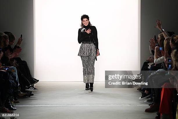 Designer Dorothee Schumacher acknowledges the applause of the audience after her show during the Mercedes-Benz Fashion Week Berlin A/W 2017 at...