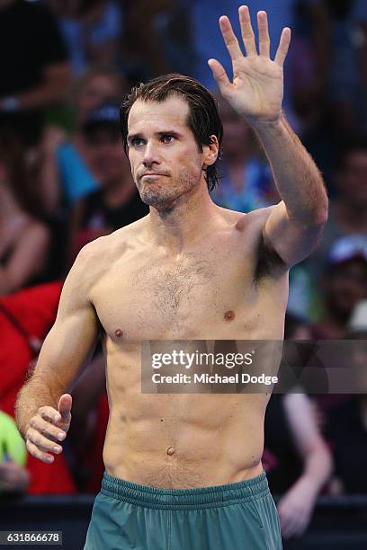 Tommy Haas of Germany waves to fans after retiring in his first round match against Benoit Paire of France on day two of the 2017 Australian Open at...