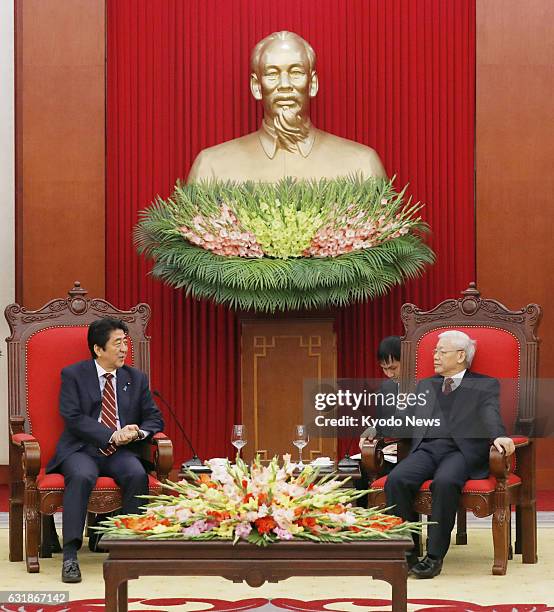 Japan's Prime Minister Shinzo Abe meets with Nguyen Phu Trong, general secretary of the Communist Party of Vietnam, in Hanoi on Jan. 16 to help...