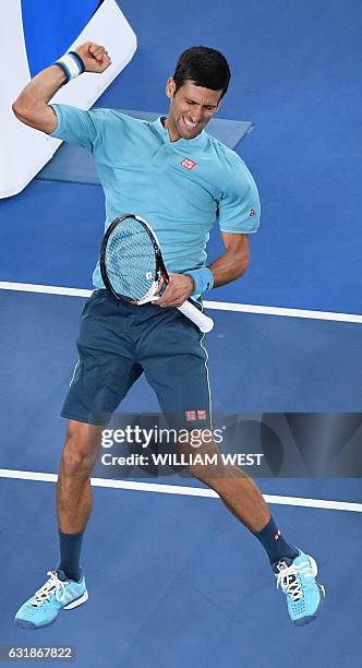 Serbia's Novak Djokovic celebrates his win against Spain's Fernando Verdasco during their men's singles match on day two of the Australian Open...