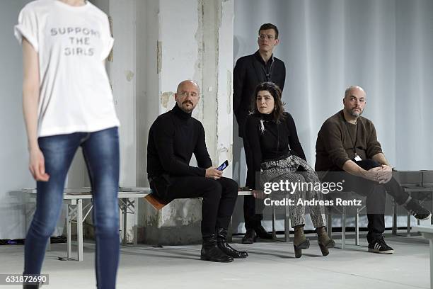 Dorothee Schumacher and members of her team watch models during the rehearsal ahead of the Dorothee Schumacher show during the Mercedes-Benz Fashion...