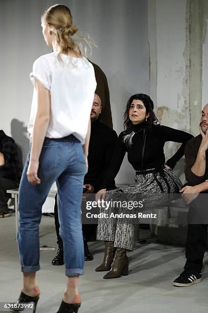 Dorothee Schumacher and members of her team watch models during the rehearsal ahead of the Dorothee Schumacher show during the Mercedes-Benz Fashion...