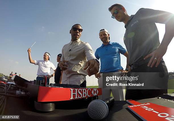 Ian Poulter of Engand, Rickie Fowler of the USA, DJ Reggie Yates, Dustin Johnson of the USA and Henrik Stenson of Sweden during a photocall on the...