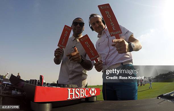 Reggie Yates and Ian Poulter of England during a photocall on the driving range prior to the Abu Dhabi HSBC Championship at Abu Dhabi Golf Club on...