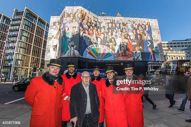 Chef Artist Sir Peter Blake poses with hotel doormen for a photo in front of Mandarin Oriental Hyde Park as a new artwork "Our Fans" by Sir Peter...