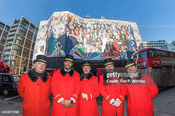 Chef Hotel doormen pose for a photo in front of Mandarin Oriental Hyde Park as a new artwork "Our Fans" by Sir Peter Blake is unveiled on January 17,...