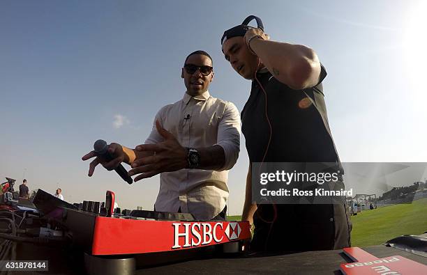 Reggie Yates and Rickie Fowler of the USA during a photocall on the driving range prior to the Abu Dhabi HSBC Championship at Abu Dhabi Golf Club on...