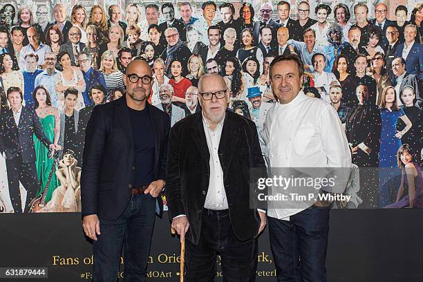 Actor Stanley Tucci, artist Sir Peter Blake and Chef Daniel Boulud pose for a photo as a new artwork "Our Fans" by Sir Peter Blake is unveiled on...