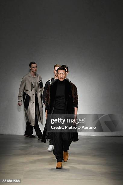 Actor Hu Bing walks the runway at the Consistence show during Milan Men's Fashion Week Fall/Winter 2017/18 on January 17, 2017 in Milan, Italy.